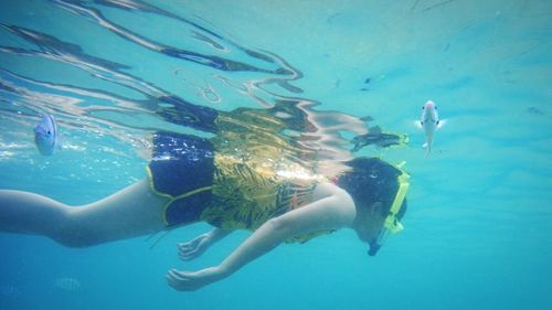 Woman snorkeling undersea