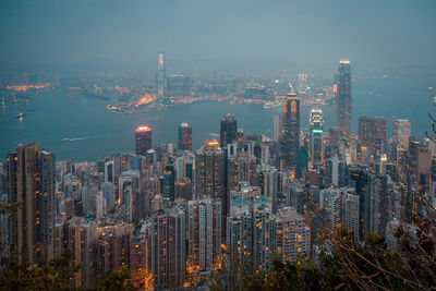 Aerial view of modern buildings in city against sky