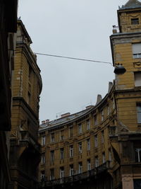 Low angle view of buildings against clear sky