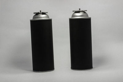 Close-up of bottle on table against white background