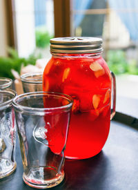 Close-up of drink in glass jar on table