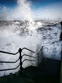 Close-up of railing against sea