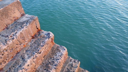 High angle view of rock formation in sea