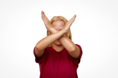 Full length of happy girl standing against white background