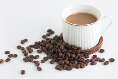 Close-up of coffee cup on white background