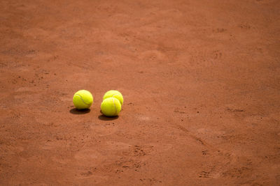 High angle view of tennis balls on court