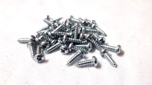 Close-up of rings on table against white background