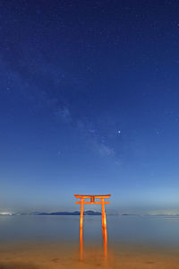 Scenic view of sea against star field at night