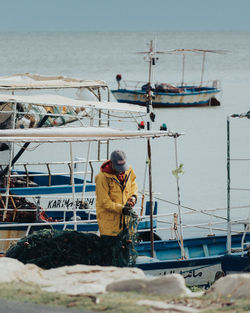 Rear view of man standing on rock