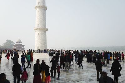 Tourists at town square during winter