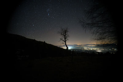 Scenic view of silhouette landscape against sky at night
