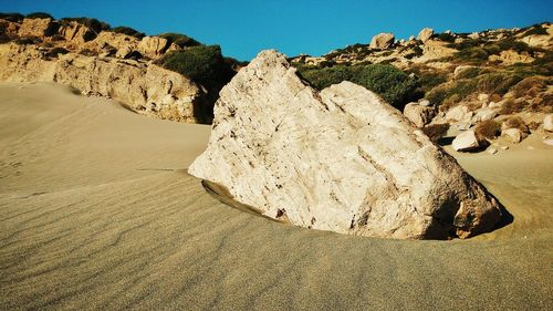 Rock formations on landscape against clear sky