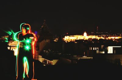 Illuminated buildings in city at night