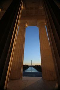 Low angle view of architectural column in historic building against sky