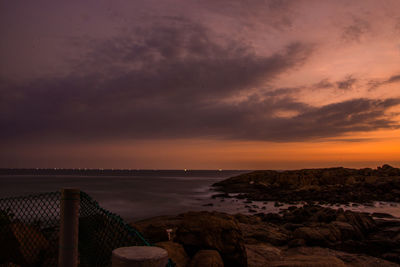 Scenic view of sea against sky at sunset