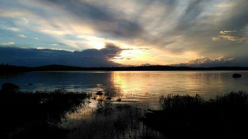 Scenic view of lake against sky during sunset