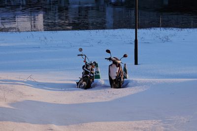 View of motorcycle on snow covered land