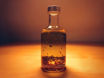 Close-up of glass bottle on table