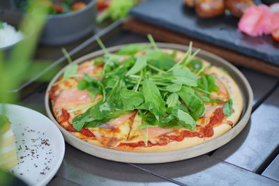 High angle view of pizza in plate on table