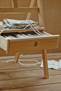 Close-up of chairs on table at home