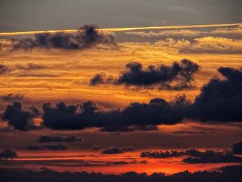 Scenic view of dramatic sky during sunset