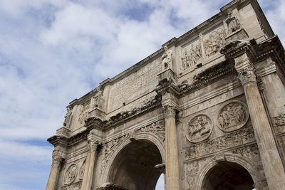 Low angle view of historical building against cloudy sky