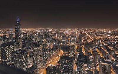 Aerial view of illuminated cityscape at night