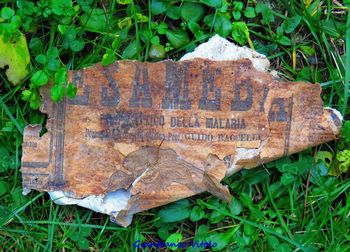 High angle view of old rusty metal on field