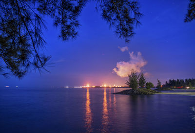 Scenic view of sea against sky at night