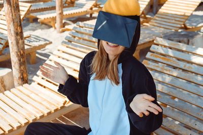 Young woman sitting on seat