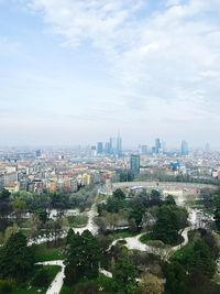 High angle view of city against cloudy sky