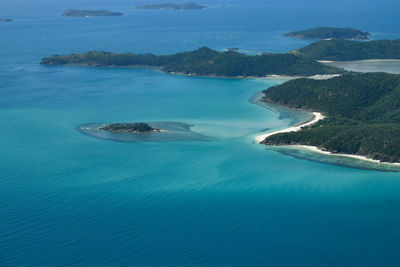 High angle view of sea and island against sky