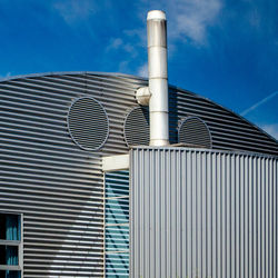 Low angle view of building against blue sky