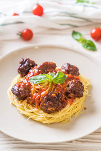 Close-up of pasta served in plate on table