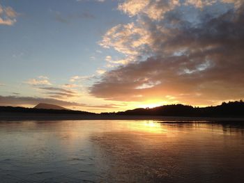 Scenic view of lake against sky during sunset