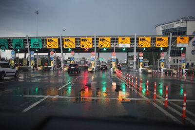 Cars on wet street in rainy season