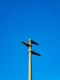 Low angle view of street light against clear blue sky