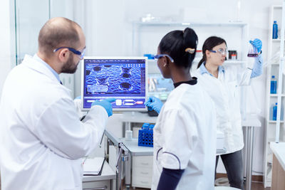 Female doctor examining patient in clinic