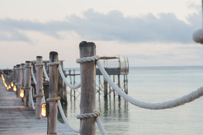 Close-up of railing against sea