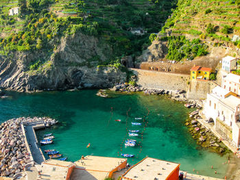 High angle view of houses by sea and mountain at cinque terre