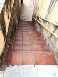 High angle view of steps leading towards wall