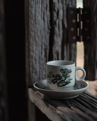 Close-up of coffee cup on table