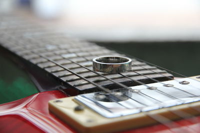 Close-up of ring on guitar