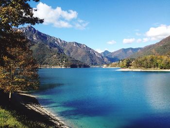 Scenic view of calm lake against mountain range