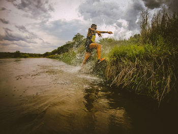 Scenic view of splashing water against sky