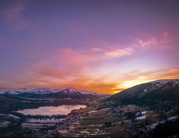 Aerial view of townscape against sky during sunset