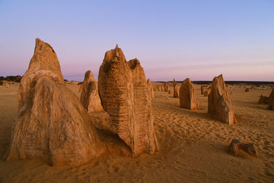 Rock formations in desert against sky