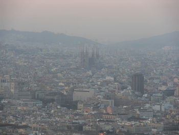 High angle view of buildings in city against sky