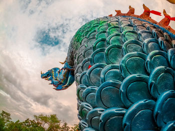 Low angle view of statue against sky