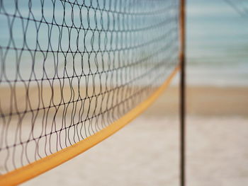 Close-up of soccer ball on beach